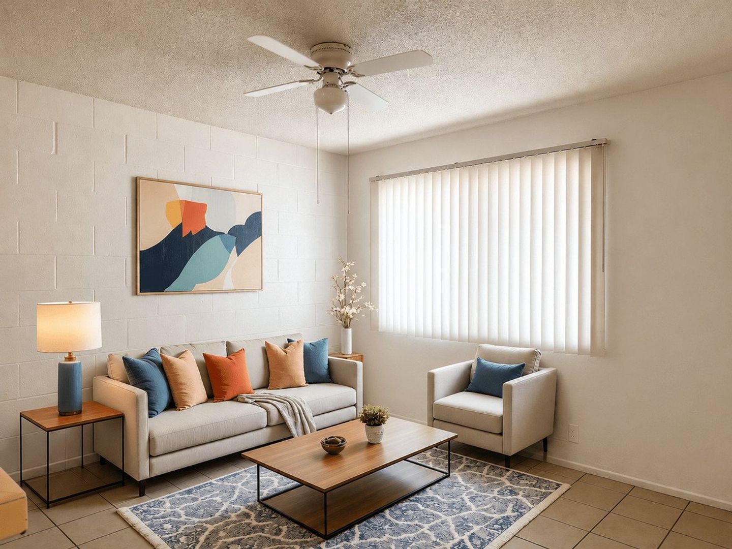 Furnished apartment living area shown — representative home at 12 Palms Apartments.