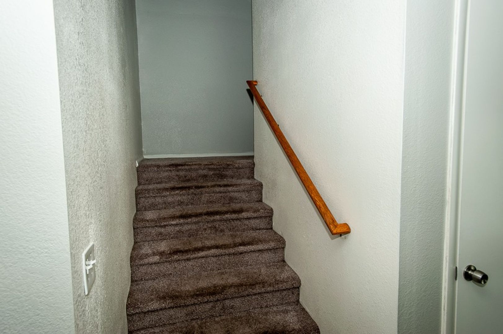 Interior staircase in the home shown — representative home at 35th Avenue Townhouse.