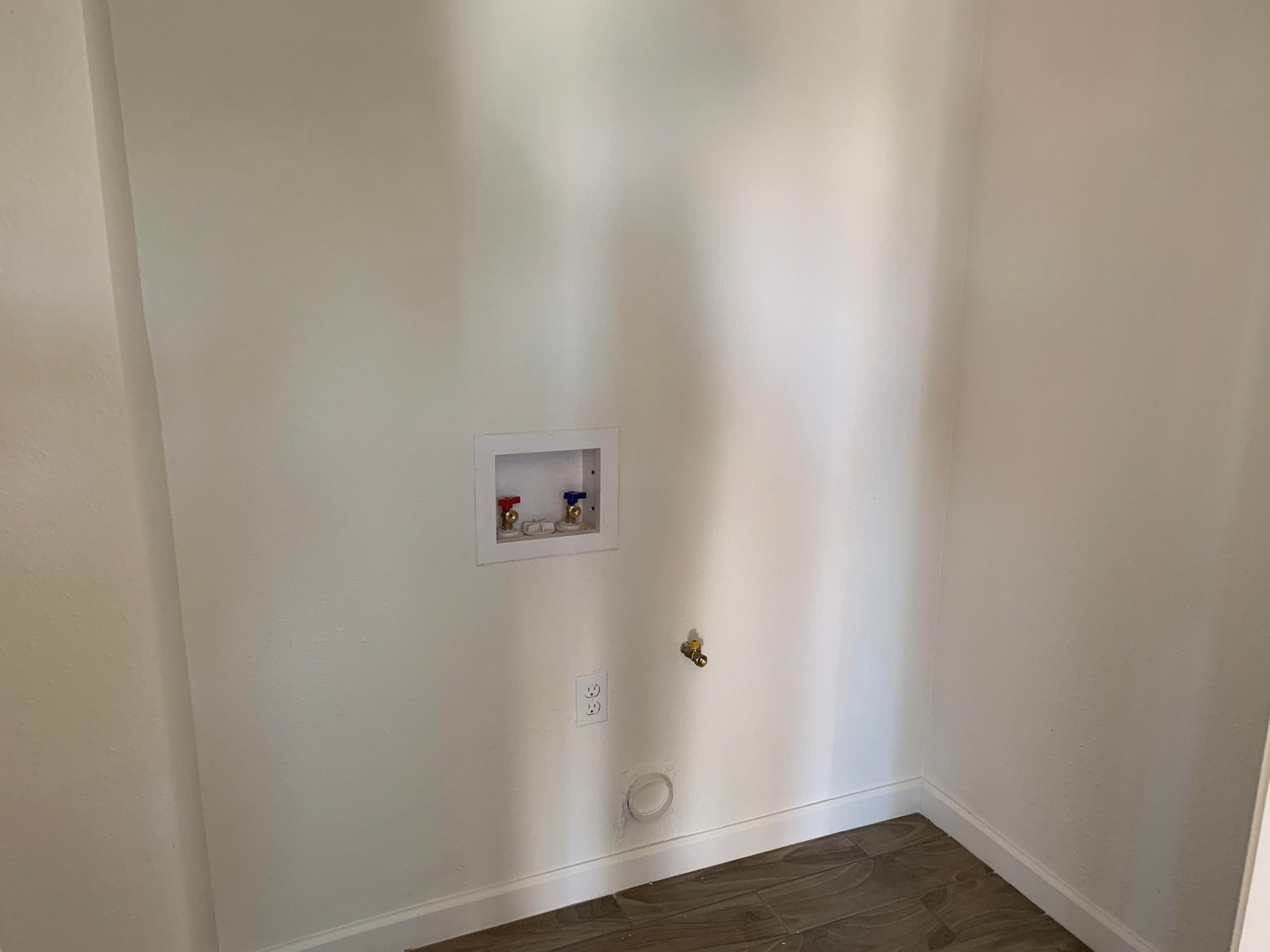 Washer and dryer hookup area at Highland West Casitas.