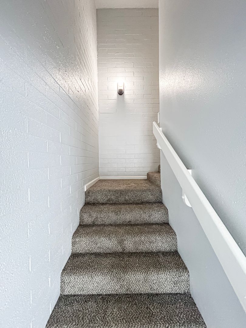 Representative interior staircase in the home shown at Villa Serena.
