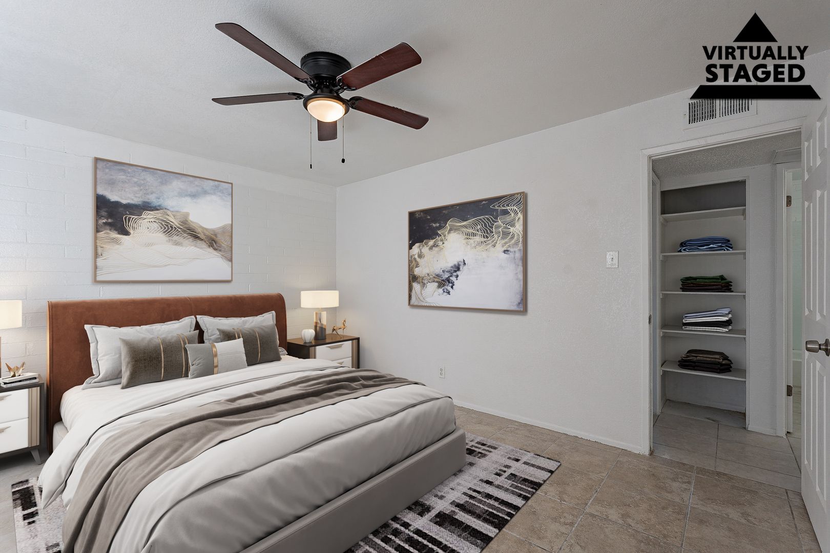 Virtually staged bedroom with ceiling fan — view 1 at Buenas @ 65th Apartments.