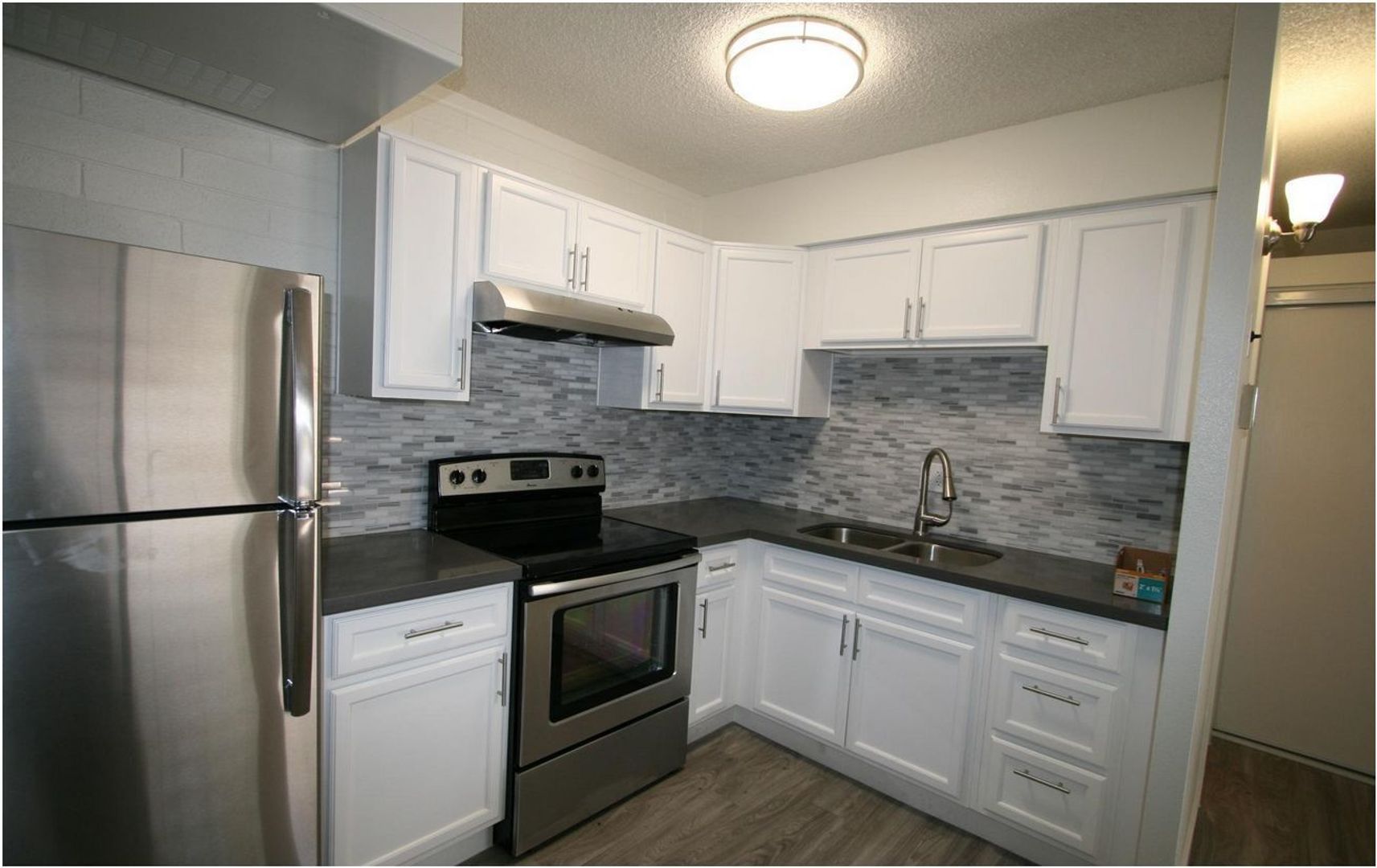 Apartment kitchen — representative home at 12 Palms Apartments.