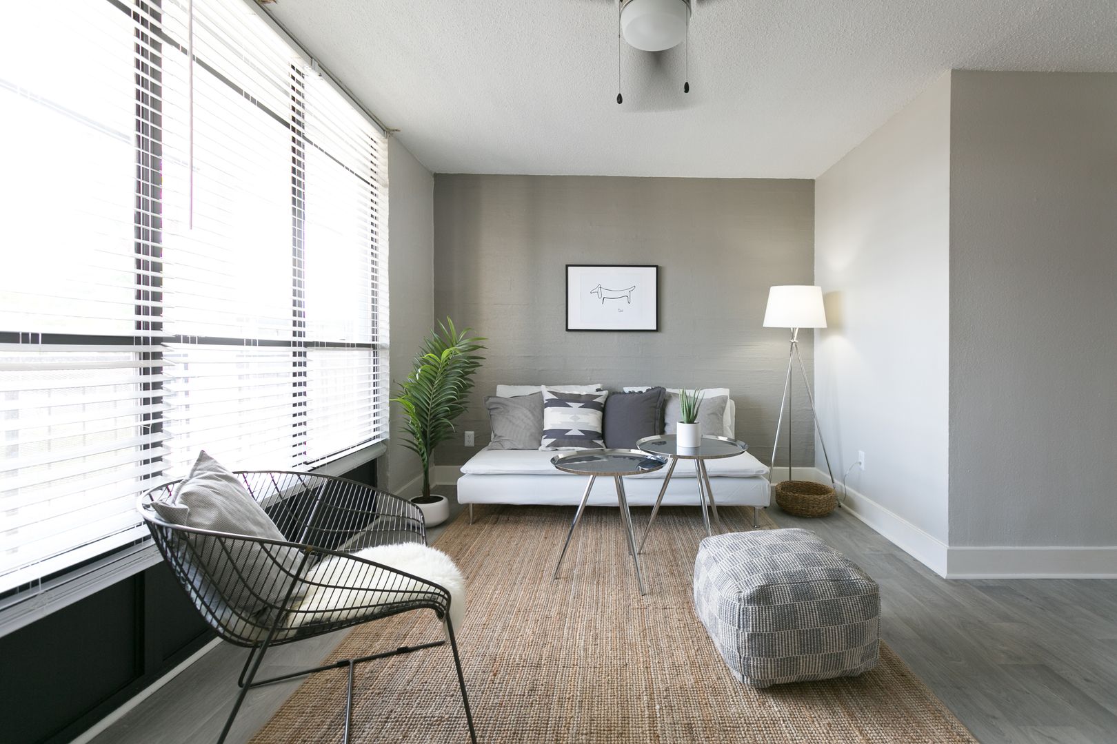 Furnished apartment living area shown — representative home at The Marlowe.