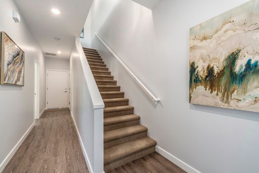 Interior staircase in the home shown — representative home at Halcyon on Cheery Lynn.