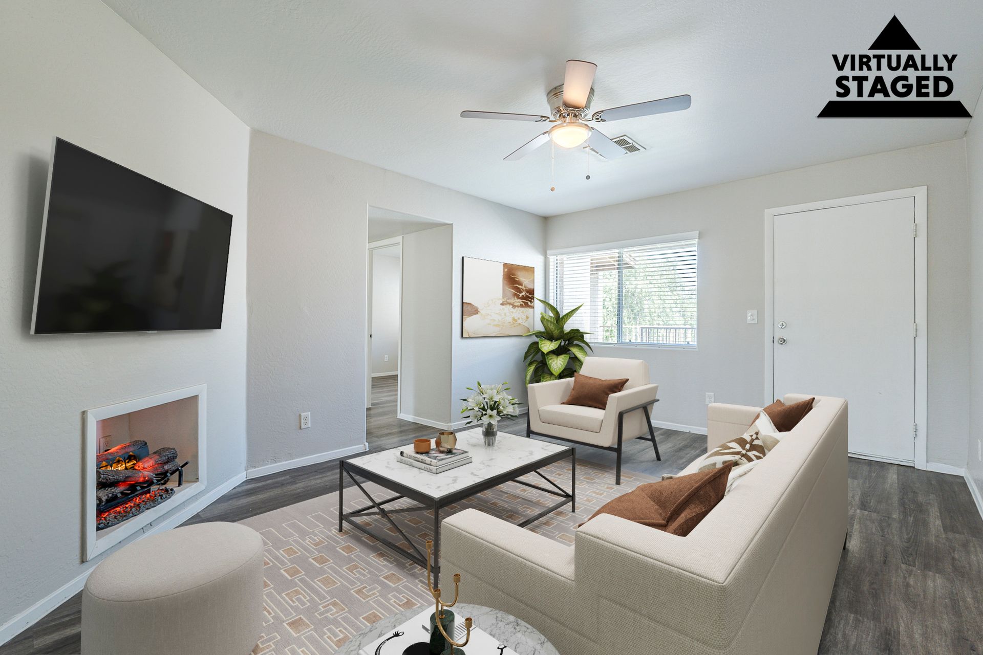 Virtually staged living area shown in Apartment 116 at Courtyard Village Apartments.