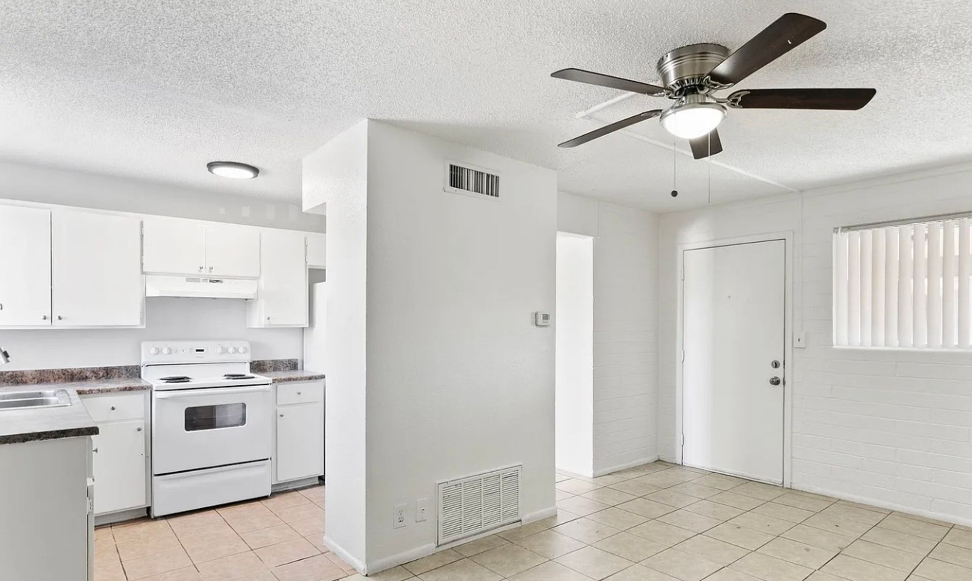 Apartment kitchen and living space at Glen Vista Apartments
