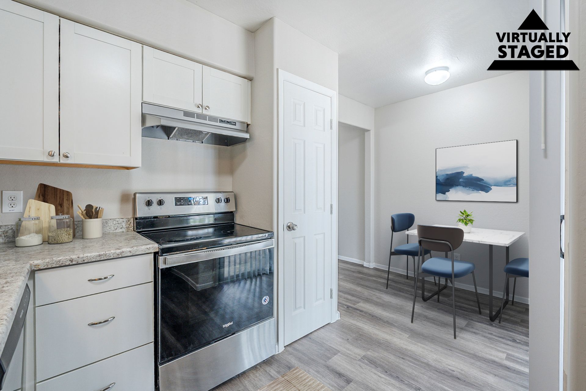 Virtually staged kitchen shown in Apartment 116 at Courtyard Village Apartments.