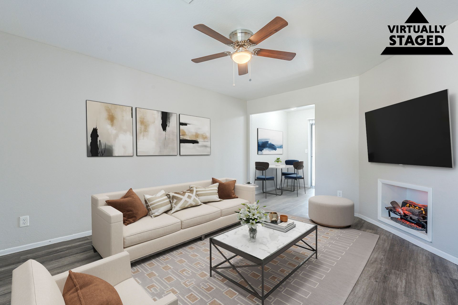 Virtually staged living area shown in Apartment 116 at Courtyard Village Apartments.