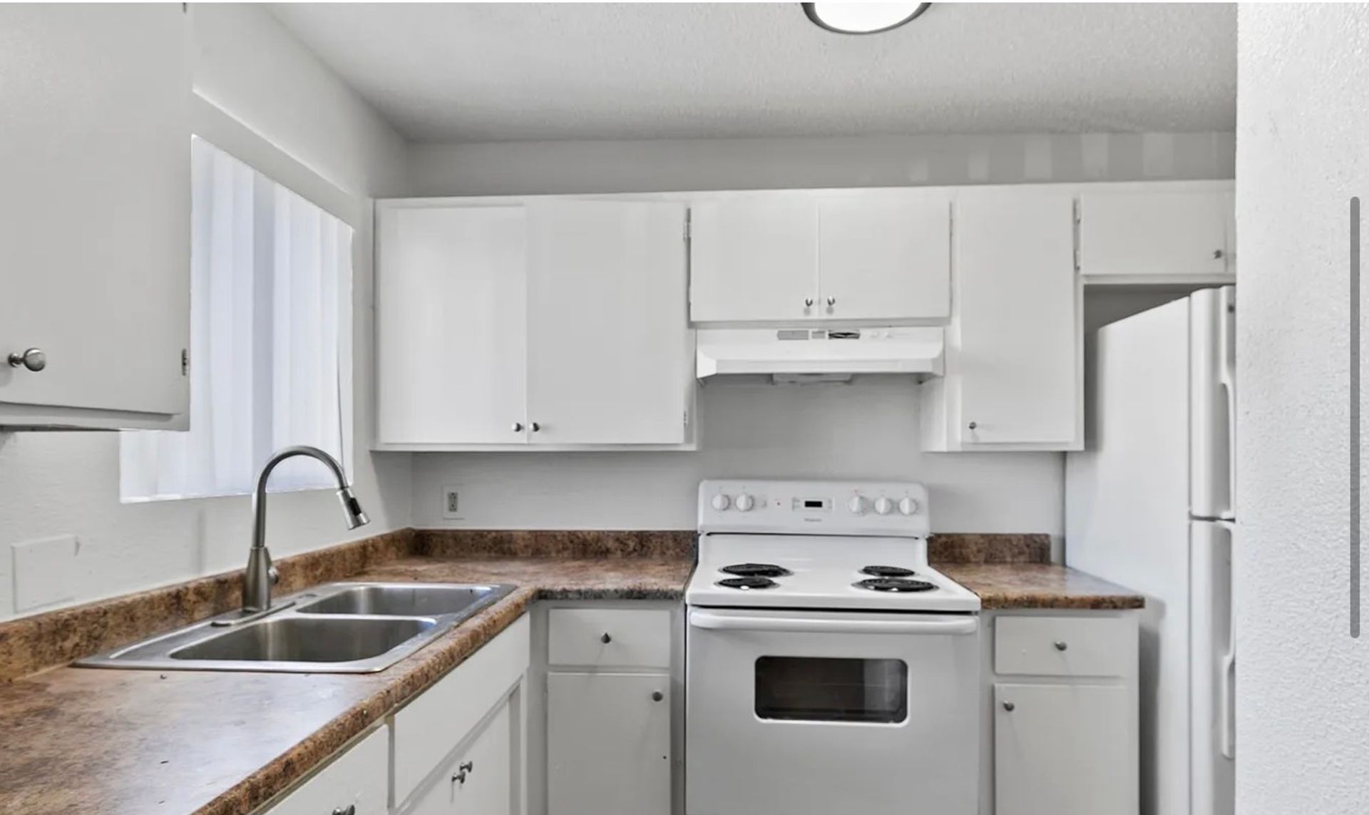Kitchen cabinets and appliances at Glen Vista Apartments