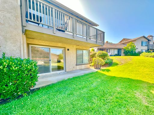 Recently Updated Downstairs Condo Unit in the Serene Pala Mesa Villas HOA Community, complete with Laundry in Unit & Garage! – photo 1