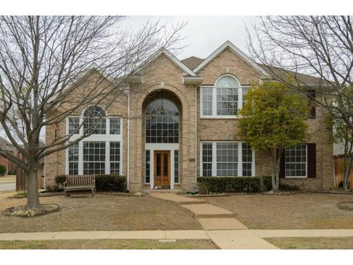 Escape to your own private resort at 2613 Owl Creek Drive in Plano—a grand 4-bedroom executive home featuring soaring cathedral ceilings, a dedicated home office, a massive game room, top-rated Plano ISD schools, and a dream backyard oasis complete with a – photo 1