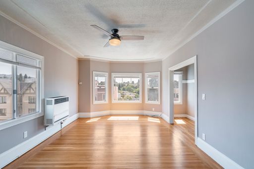 Top Floor! Large Updated 1 Bedroom (910 sf) w/Available Garage + Hardwood Floors, Cat OK! – photo 1