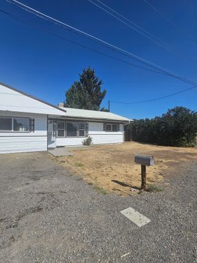 Newly Updated Home with fenced pet area & Detached Garage!
