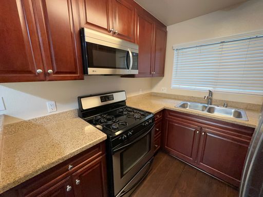 CONDO—PRIME 2 BED 2 BATH IN CENTRAL WOODLAND HILLS GATED COMMUNITY